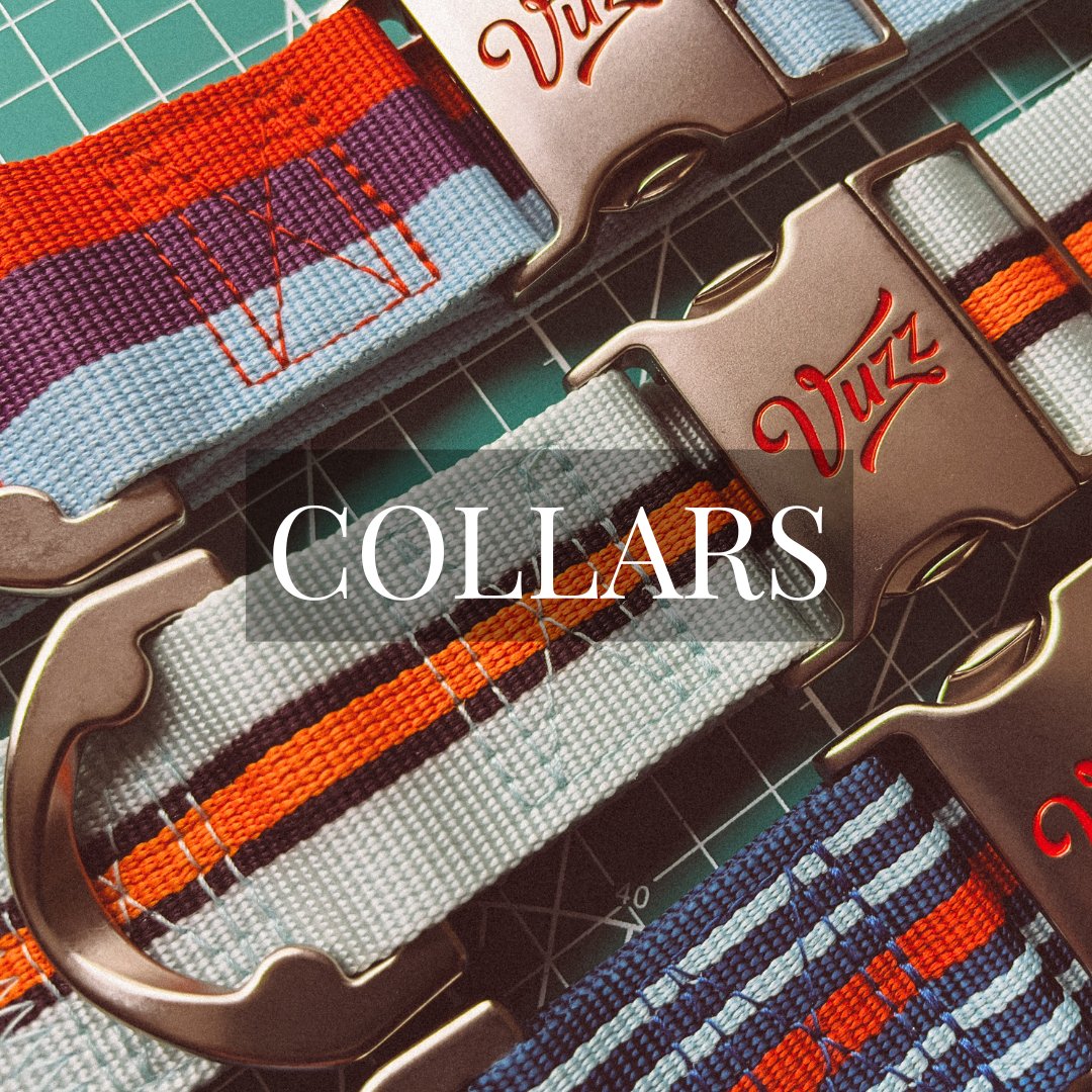 Closeup image of three Vuzz dog collars laying flat